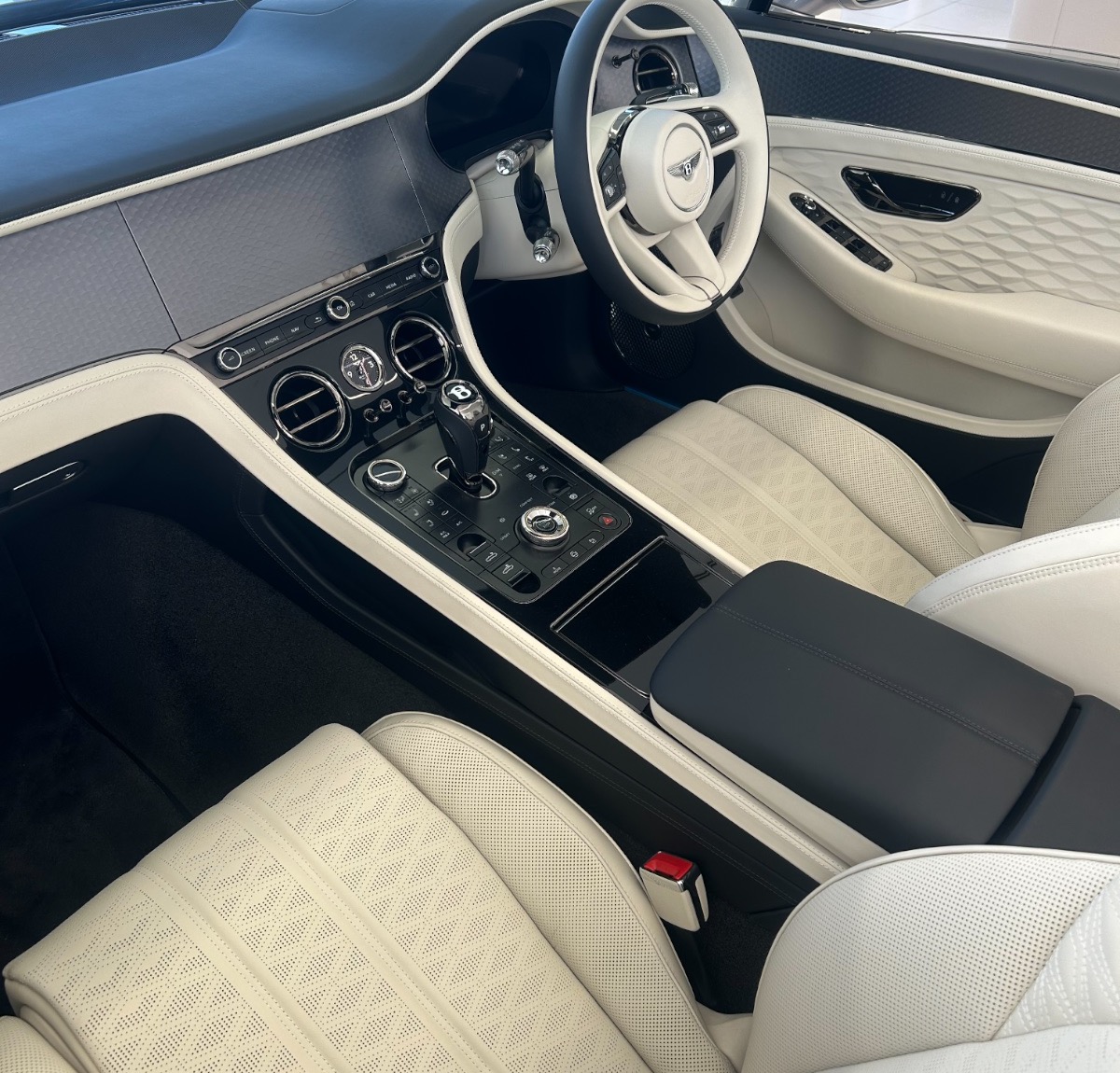 Inside the Continental GTC at Bentley Sydney - ivory diamond quilting, winged Bs on every headrest. Photography: Queen of Cars.