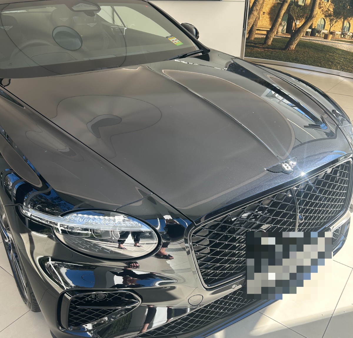 A Bentley Flying Spur in black, photographed by us at Bentley Sydney; number plate blurred per our privacy policy. Photography: Queen of Cars.
