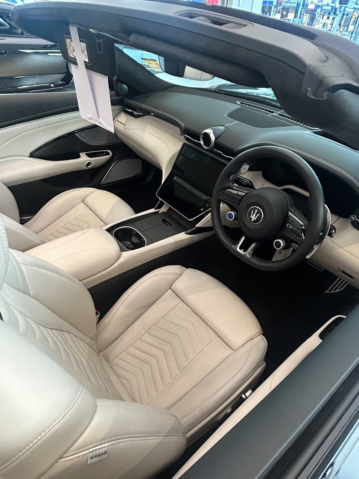 Inside the GranCabrio: trident on the wheel, sky for a roof. Photography: Queen of Cars.